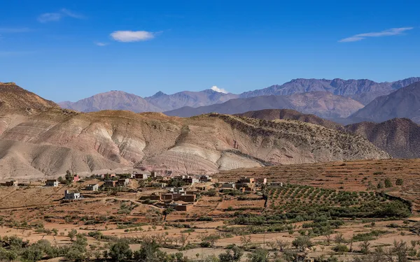 Villages and orchards below the High Atlas under a blue sky