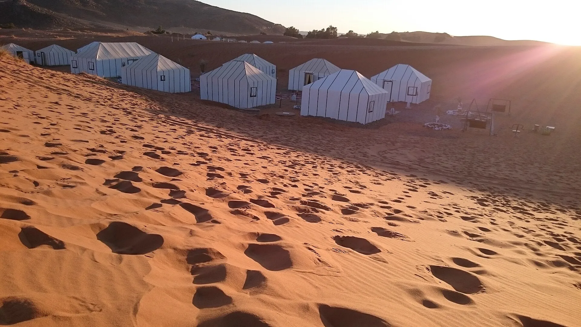 A tented camp at the foot of the Sahara dunes