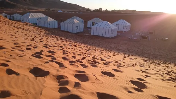 A tented camp at the foot of the Sahara dunes