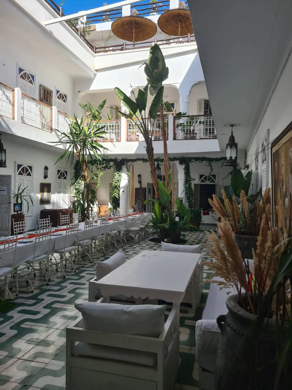 A long table laid in the courtyard of a riad